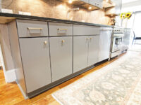 Close view of the gray kitchen cabinet