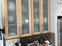 Brown glass cupboard on display